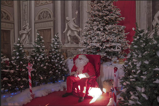 Santa Claus welcomes children to listen to their wishes and requests for Christmas Santa Claus welcomes children to listen to their wishes and requests for Christmas