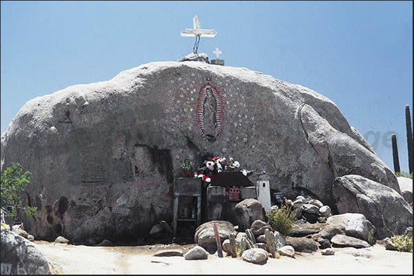 Rocky desert along Mexico 1. Votive and prayer area along the way