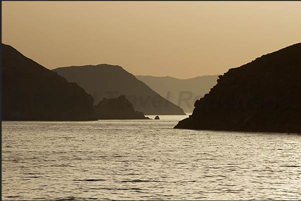 Sunset with the uninhabited island of Kardhictisa and the island of Milos on the horizon