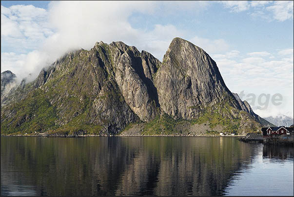 Moskenosoya Island (Lofoten), high mountains overlooking coast and villages Moskenosoya Island (Lofoten), high mountains overlooking coast and villages