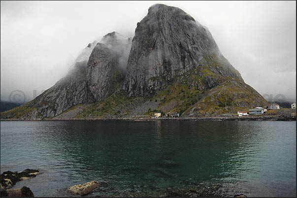 Moskenosoya Island (Lofoten), high mountains overlooking coast and villages Moskenosoya Island (Lofoten), high mountains overlooking coast and villages