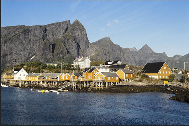 Moskenosoya island, rorbu near the town of Reine. In summer the rorbu are rented by tourists on vacation in the archipelago Moskenosoya island, rorbu near the town of Reine. In summer the rorbu are rented by tourists on vacation in the archipelago