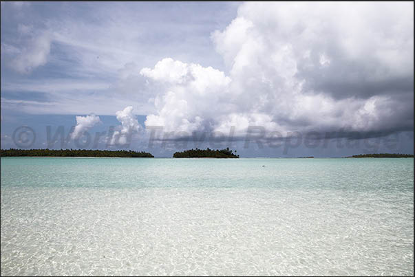 Uninhabited islands on the edge of the lagoon near the coral reef Uninhabited islands on the edge of the lagoon near the coral reef
