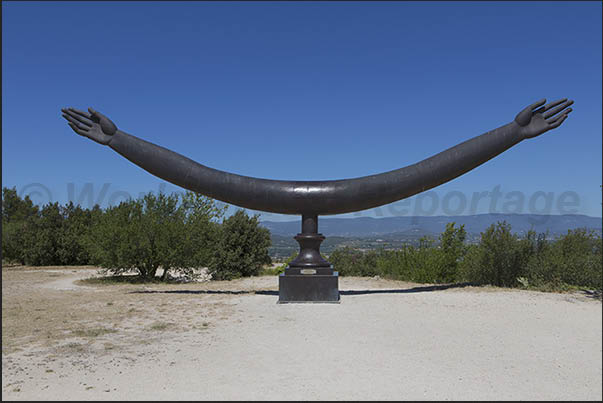 Artwork on display in the square at the entrance to the De Sade castle, now owned by the fashion designer Pierre Cardin