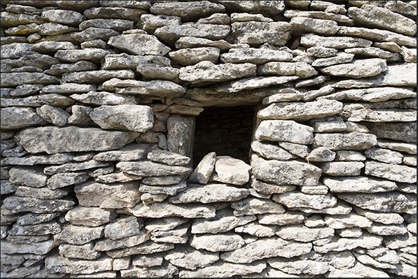 The windows, without glass, are very small to avoid letting in the cold The windows, without glass, are very small to avoid letting in the cold