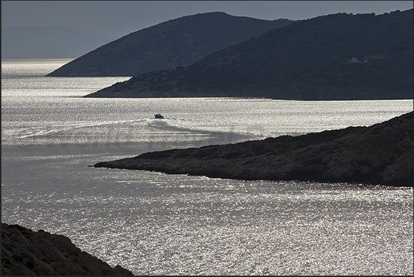 Sunset on the west coast between Aegliali bay and the island of Nikouria