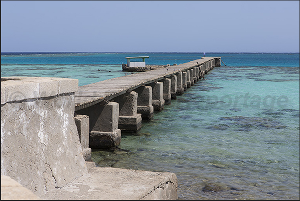 The pier on the side of the large lagoon protected by the reef