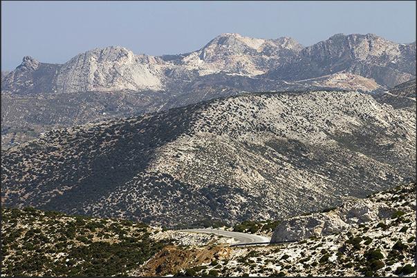 Mountains with the marble quarries of Latomia seen from the road leading to Kalanigou bay Mountains with the marble quarries of Latomia seen from the road leading to Kalanigou bay