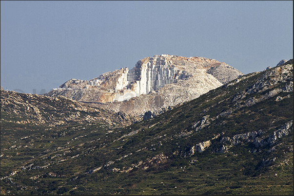 Mountains with the marble quarries of Latomia seen from the road leading to Kalanigou bay Mountains with the marble quarries of Latomia seen from the road leading to Kalanigou bay