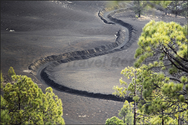 The roads carved into the lava run through the volcanic areas of the island The roads carved into the lava run through the volcanic areas of the island