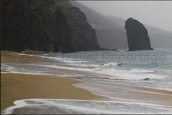 The wild coast of the Jandia Natural Park, south west coast. Cofete beach with the Bocha del Moro rock