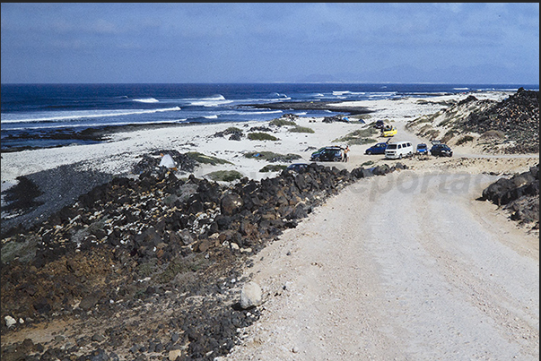 The dirt road that runs along the desert north-west coast near the Toston lighthouse The dirt road that runs along the desert north-west coast near the Toston lighthouse