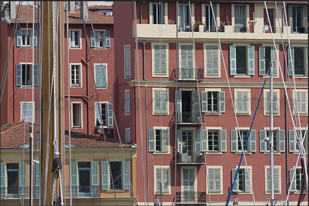 Port Lympia. Ancient and modern boats moored in front of the historic buildings of the Quai des Docks