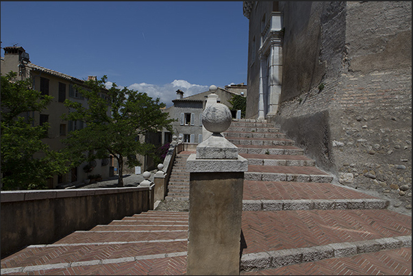 The double staircase that leads to the gates of the castle of the Grimaldi square The double staircase that leads to the gates of the castle of the Grimaldi square