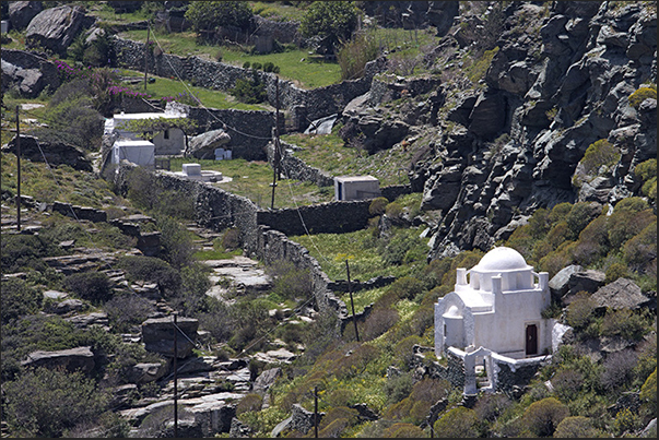 Paths flank dry stone walls and terraced crops characterize the valleys of the island