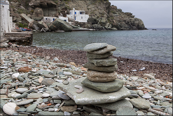 Pebble beach in Seralia bay with the fishing village