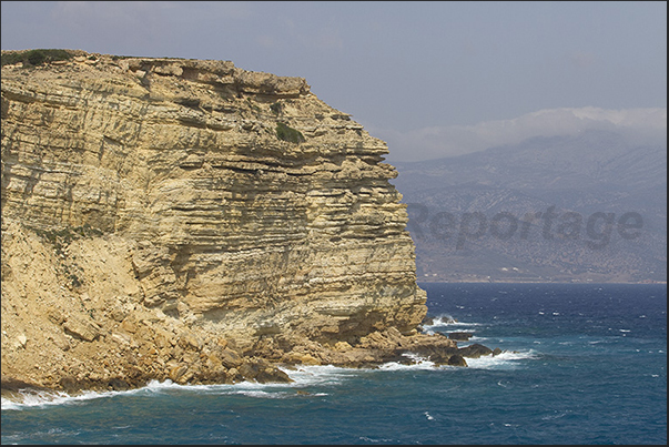 Cliff of Ksylobatis Bay (north east coast) and the island of Naxos on the horizon Cliff of Ksylobatis Bay (north east coast) and the island of Naxos on the horizon