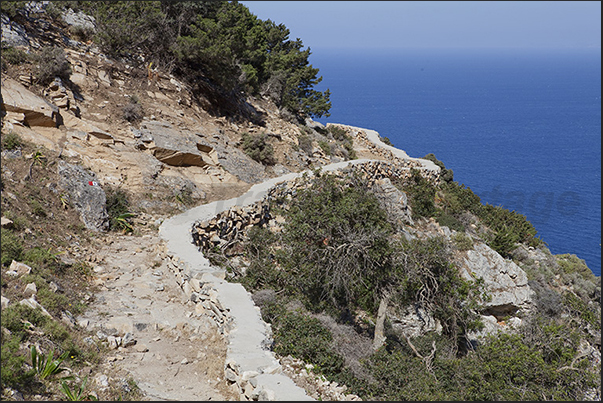 Path along the north coast leading to the caves of Polyphinos and Aghios Ioannis. Path along the north coast leading to the caves of Polyphinos and Aghios Ioannis.