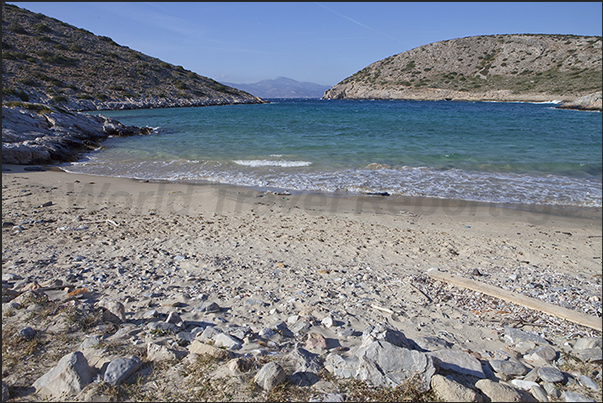 Beach at the bottom of the bay of Vourkaria and the island of Naxos which closes the bay Beach at the bottom of the bay of Vourkaria and the island of Naxos which closes the bay