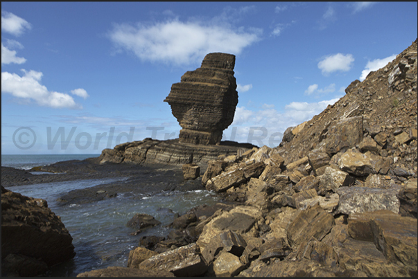 West Coast. Roche Percée, the strange rock that also gives its name to the village in the Gouaro Bay West Coast. Roche Percée, the strange rock that also gives its name to the village in the Gouaro Bay