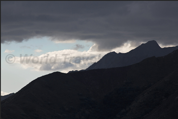 The mountains that rise along the east coast of the island near the town of Hienghène The mountains that rise along the east coast of the island near the town of Hienghène