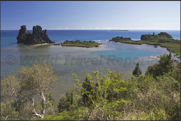 The Hienghène Bay with the island of La Poule (The Hen), so named for of its characteristic shape The Hienghène Bay with the island of La Poule (The Hen), so named for of its characteristic shape