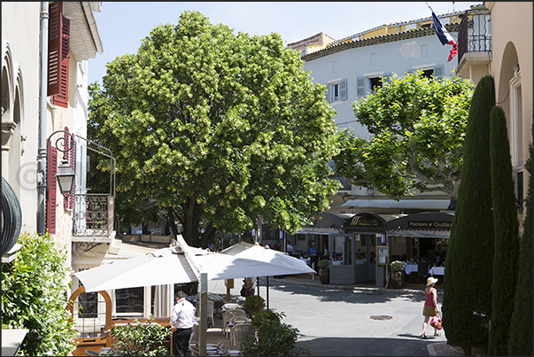 Restaurants in the Place du Commandant Lamy, the main square of the village Restaurants in the Place du Commandant Lamy, the main square of the village