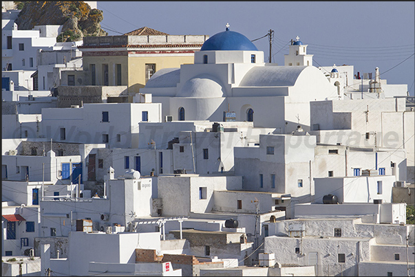 The pattern of white houses all the same and the domes of the churches characterize the city of Chora The pattern of white houses all the same and the domes of the churches characterize the city of Chora