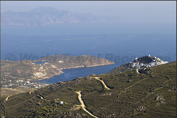 On the tip of the hill Chora (Hora) the capital of the island overlooks the bay of Livadi. On the horizon the island of Sifnos