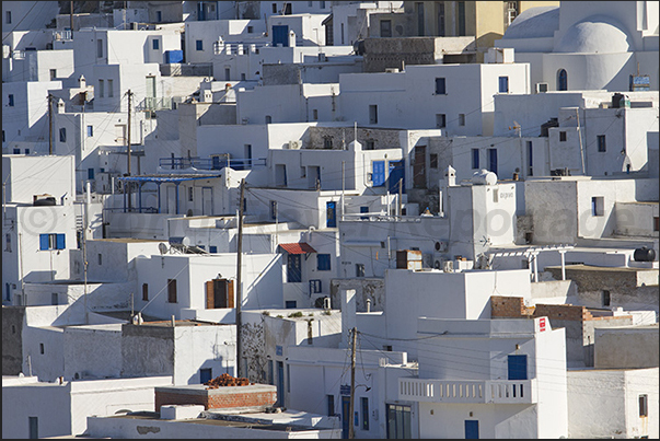 The pattern of white houses all the same characterize the city of Chora