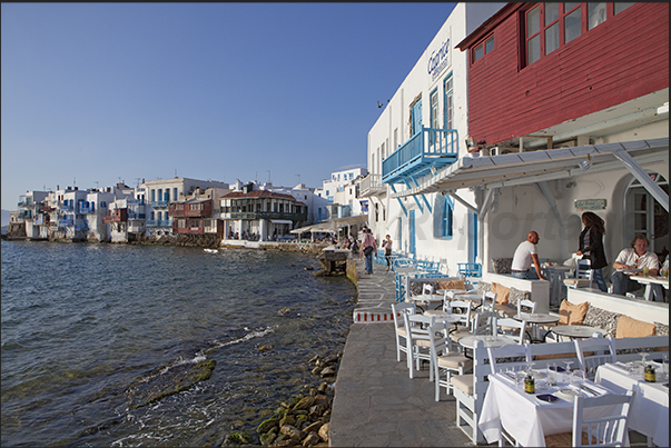 Walk along the seafront of the ancient village of Mykonos Walk along the seafront of the ancient village of Mykonos