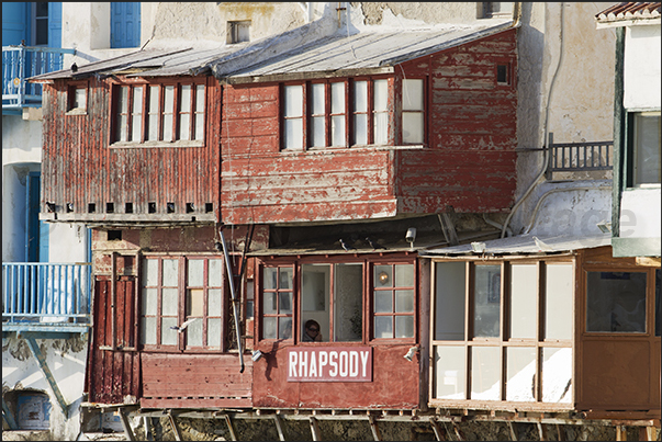 Ancient buildings overlook the sea with restaurants and clubs for aperitifs and cheerful evenings