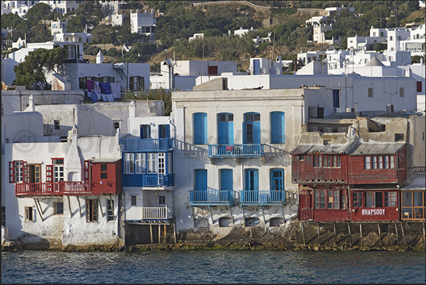 Ancient buildings overlook the sea with restaurants and clubs for aperitifs and cheerful evenings