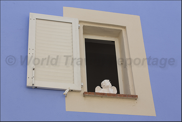 Decorations at the windows of Rue Frédéric Mistral, the last street south of the village Decorations at the windows of Rue Frédéric Mistral, the last street south of the village