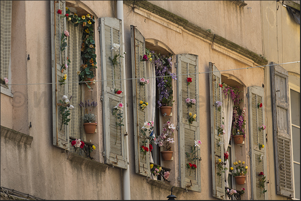 Windows decorated with flowers in the alleys of the historic center Windows decorated with flowers in the alleys of the historic center