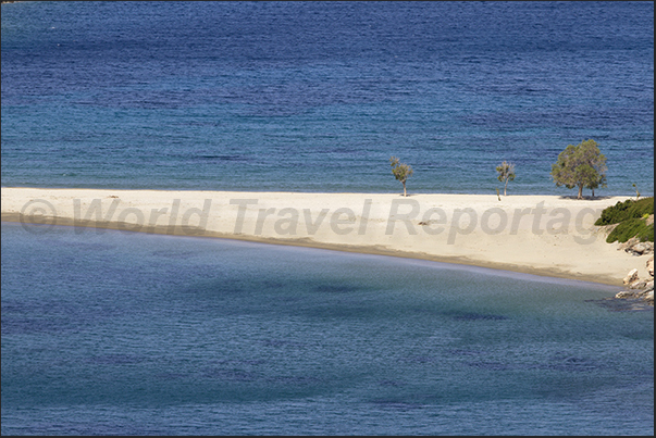 Apokrousi Bay with the sandy strip that connects the coast to the island of Kolona Apokrousi Bay with the sandy strip that connects the coast to the island of Kolona