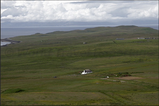 Pastures and farms on the north-eastern coast of the island Pastures and farms on the north-eastern coast of the island