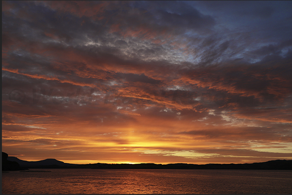 Sunset over Loch Harport Bay where the town of Port Nalong is located Sunset over Loch Harport Bay where the town of Port Nalong is located