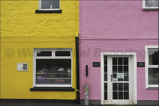 Portree fishing village. Dozens of colorful houses line the village's waterfront Portree fishing village. Dozens of colorful houses line the village's waterfront