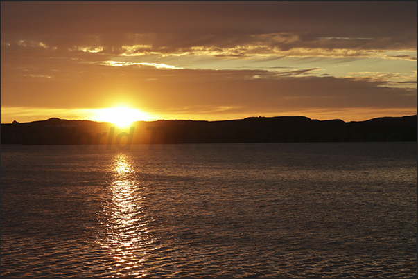 Sunset over Loch Harport Bay where the town of Port Nalong is located Sunset over Loch Harport Bay where the town of Port Nalong is located