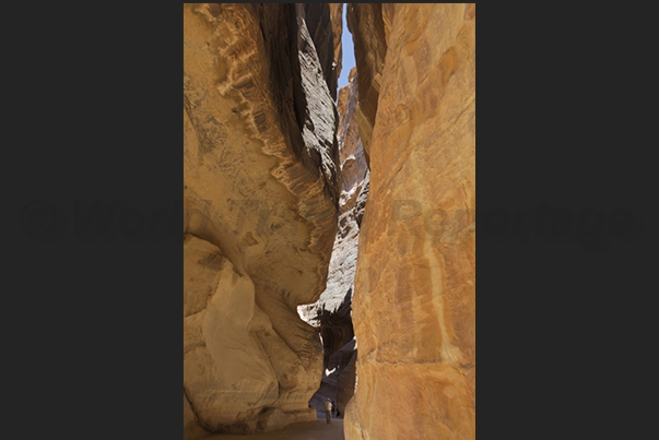 Carved into brittle rock in the desert, the Al-Siq canyon is the way most known by tourists to access in Petra Carved into brittle rock in the desert, the Al-Siq canyon is the way most known by tourists to access in Petra