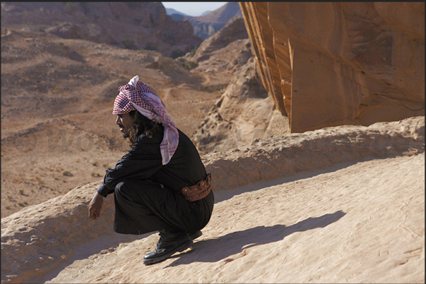 A Berber guide looks at the view from the roof of the temple of Al-Deir A Berber guide looks at the view from the roof of the temple of Al-Deir