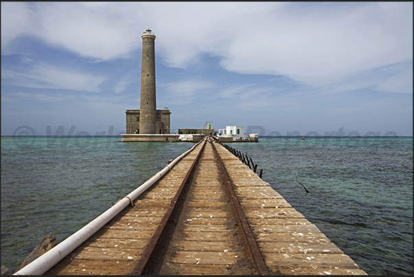The south jetty of Sanganeb lighthouse with the cart on railway to bring the supplies of water and food to the lighthouse keepers The south jetty of Sanganeb lighthouse with the cart on railway to bring the supplies of water and food to the lighthouse keepers