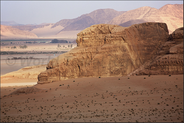 Wadi Ram is a continuous succession of plains interrupted by wide valleys formed by high rocky mountains Wadi Ram is a continuous succession of plains interrupted by wide valleys formed by high rocky mountains