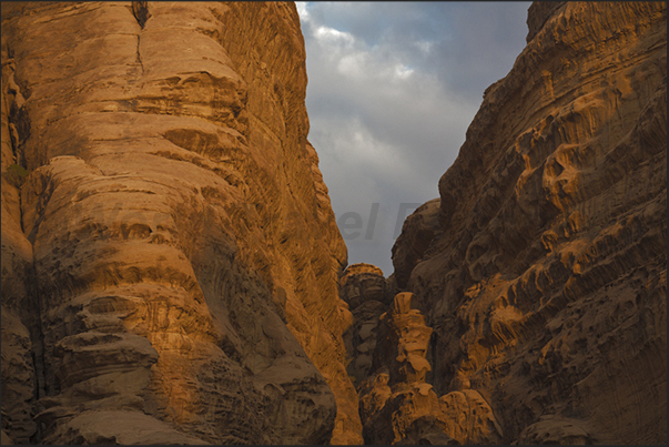 At sunset, the mountains begin to color, first orange and then red