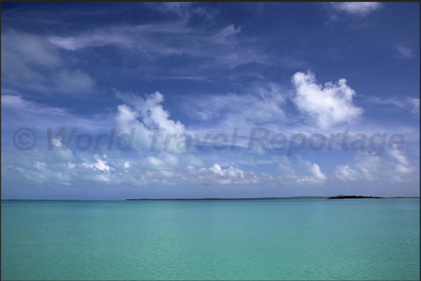 On the horizon, the islands on the reef near the southern tip of the lagoon