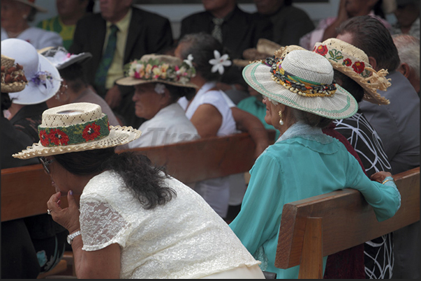 On Sunday, at church at Arutanga, women wear their best hats, some simple others elaborated