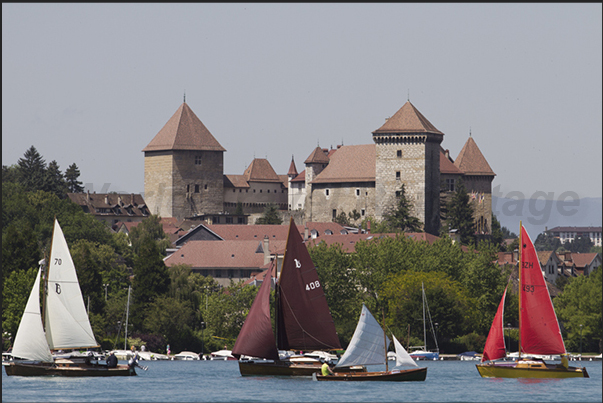 Regatta in front of the castle. The old town of Annecy Regatta in front of the castle. The old town of Annecy