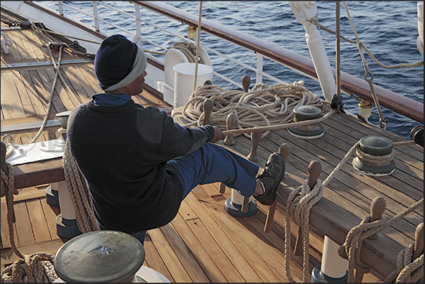 Sailor on the maneuvers of the jibs sails on the bow. During the cruise you can participate, along with sailors, to hoist the sails Sailor on the maneuvers of the jibs sails on the bow. During the cruise you can participate, along with sailors, to hoist the sails