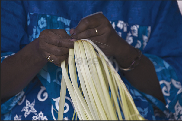 The women of Roh village, get ornaments for the celebration of Wajuyu intertwining palm leaves The women of Roh village, get ornaments for the celebration of Wajuyu intertwining palm leaves